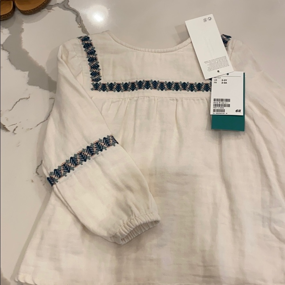 White H&M long sleeve with green/pink embroidery